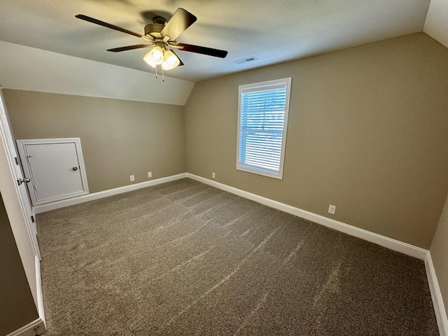 bonus room with vaulted ceiling, carpet, and ceiling fan