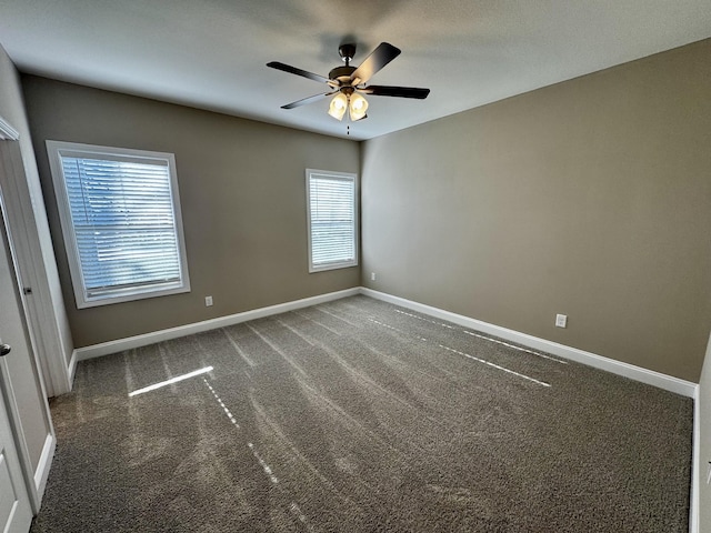 carpeted empty room with ceiling fan