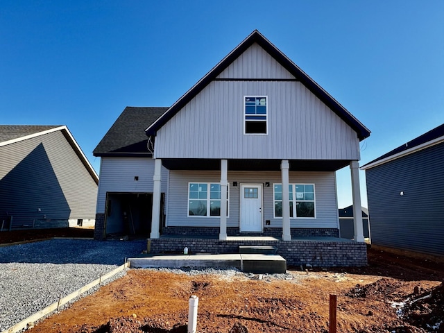 view of front of home with a garage and covered porch