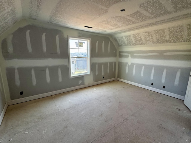 bonus room with vaulted ceiling