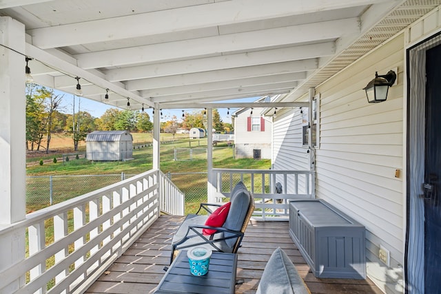 wooden terrace with a storage unit