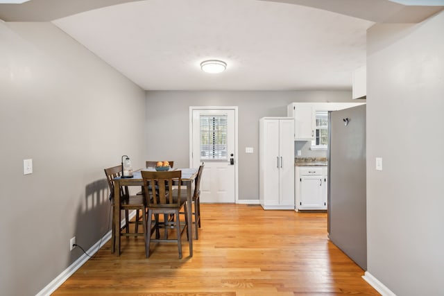 dining area with light wood-type flooring