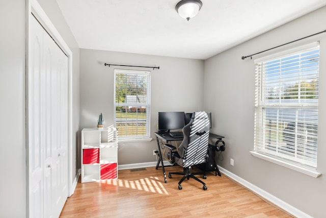 office space with wood-type flooring