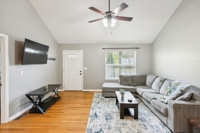 living room featuring lofted ceiling, hardwood / wood-style floors, and ceiling fan