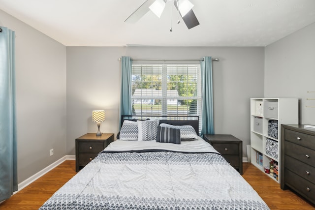 bedroom featuring ceiling fan and dark hardwood / wood-style flooring