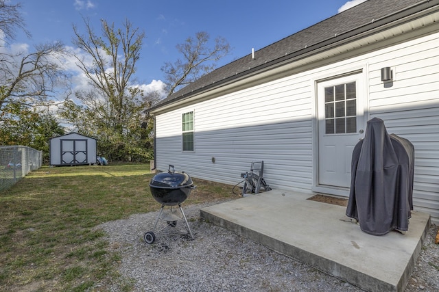 view of patio / terrace featuring area for grilling and a storage unit