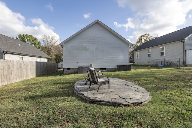 view of yard featuring a patio area and central AC unit