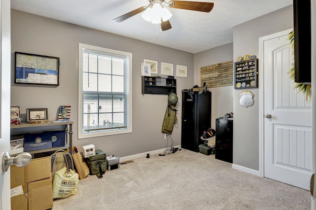 misc room with carpet flooring and ceiling fan