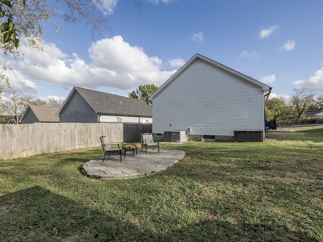 back of house featuring a patio, cooling unit, and a yard