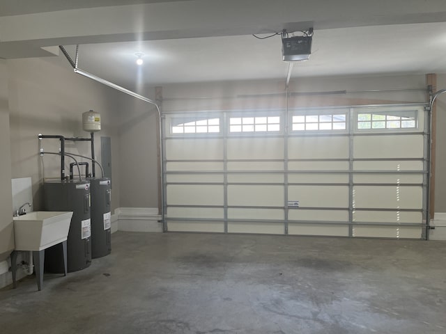 garage featuring a garage door opener and electric water heater