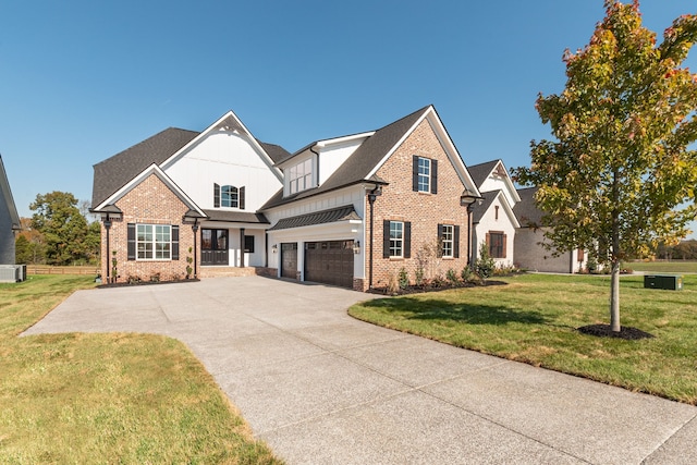 view of front facade with a front lawn and a garage