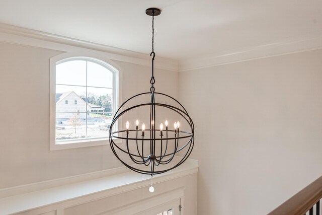 room details with crown molding and a chandelier