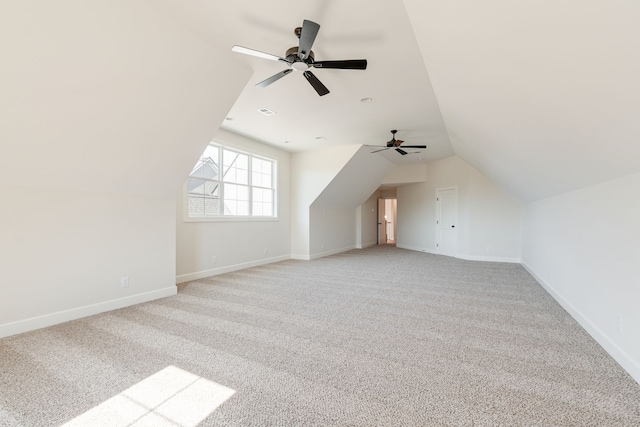 bonus room featuring light colored carpet, vaulted ceiling, and ceiling fan