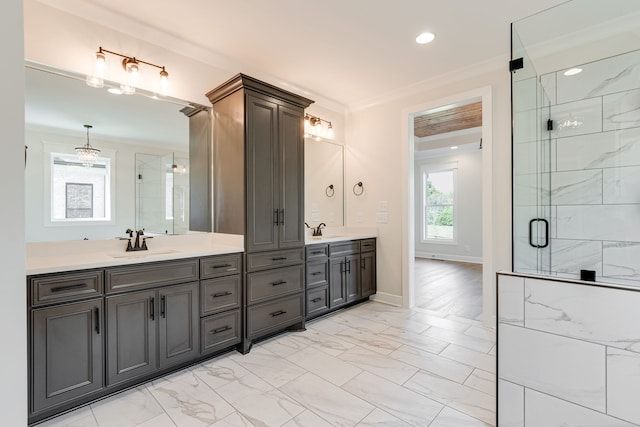 bathroom featuring a shower with door, ornamental molding, and vanity