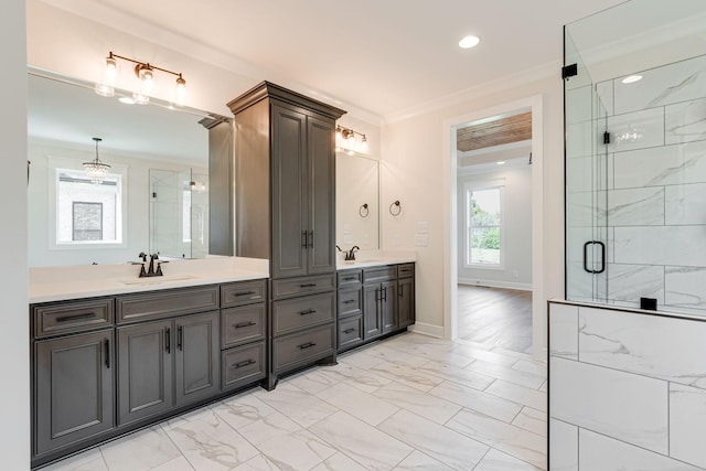 full bathroom featuring vanity, marble finish floor, crown molding, and a stall shower