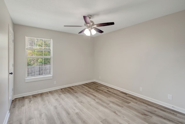 empty room featuring ceiling fan and light hardwood / wood-style flooring