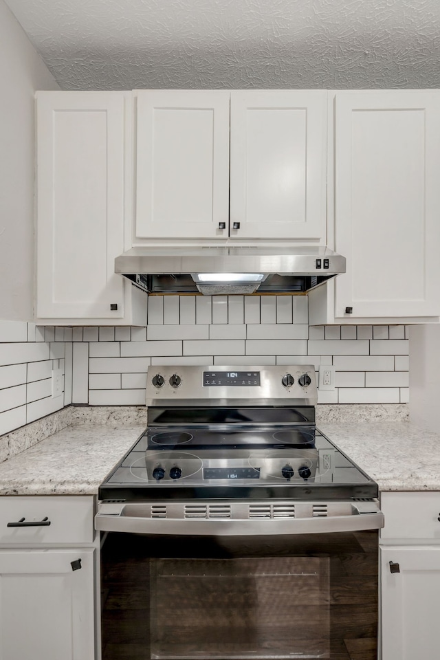 kitchen with white cabinetry and stainless steel electric range oven