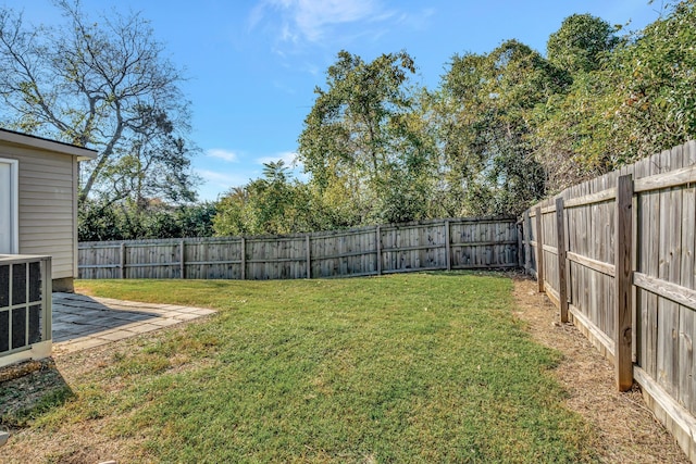 view of yard featuring central air condition unit