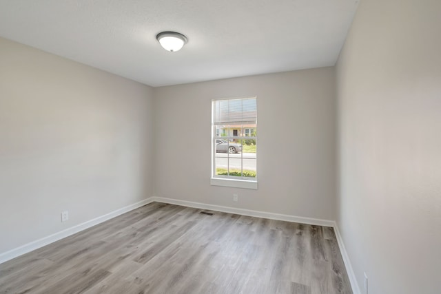 unfurnished room featuring light wood-type flooring