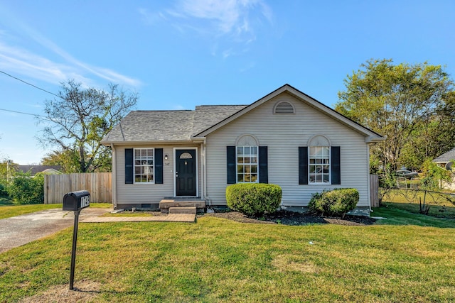 ranch-style home featuring a front yard