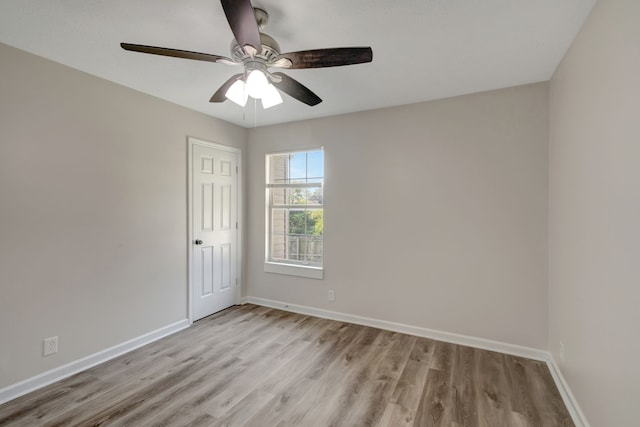 empty room featuring ceiling fan and light wood-type flooring