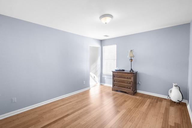 bedroom with wood-type flooring