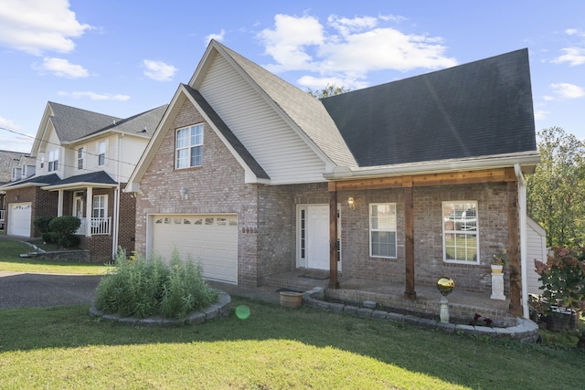 view of front facade with a front yard and a garage