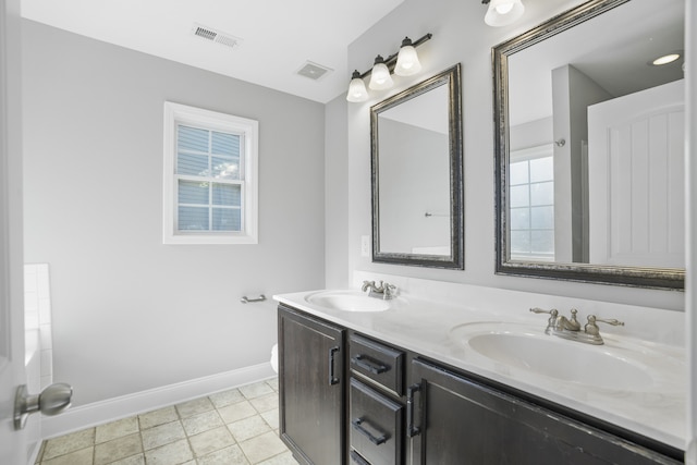 bathroom with vanity and tile patterned floors