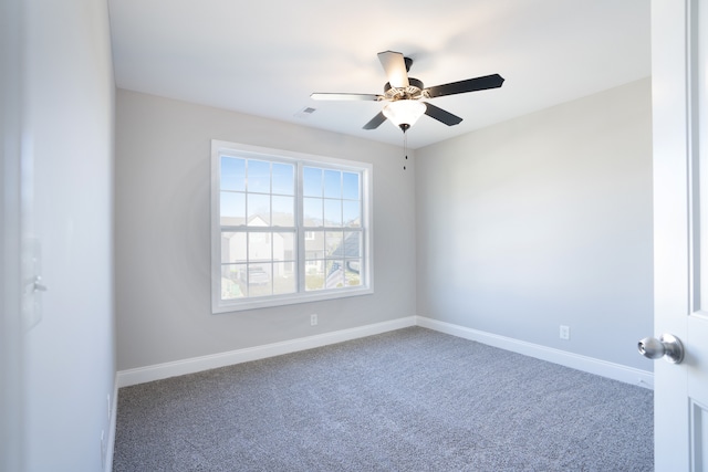 empty room with carpet flooring and ceiling fan