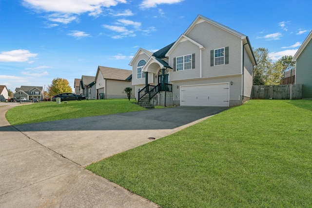 view of front of home featuring a front yard and a garage