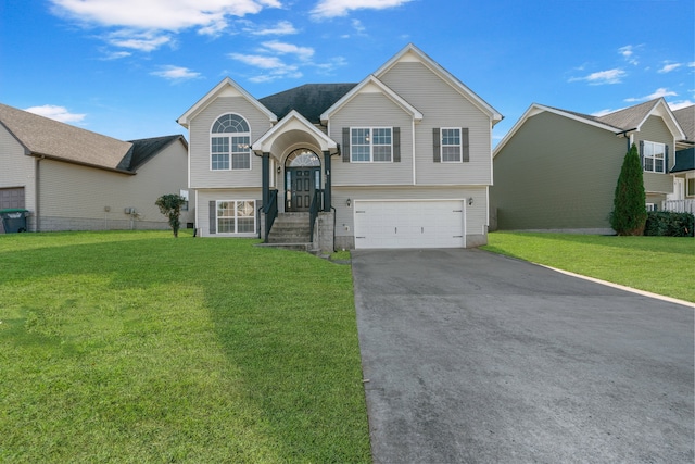 bi-level home with a front lawn and a garage