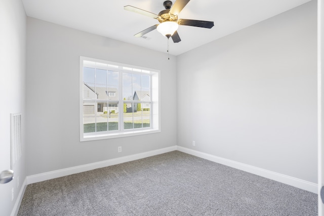 spare room with ceiling fan and carpet flooring