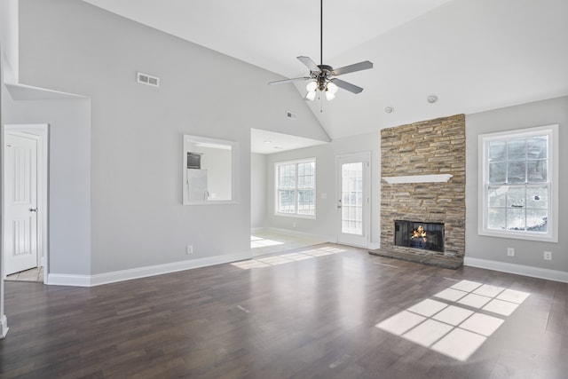 unfurnished living room featuring a fireplace, dark hardwood / wood-style floors, high vaulted ceiling, and ceiling fan