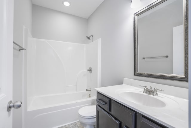 full bathroom featuring vanity, tub / shower combination, and toilet