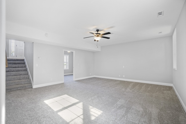 spare room with carpet floors and ceiling fan