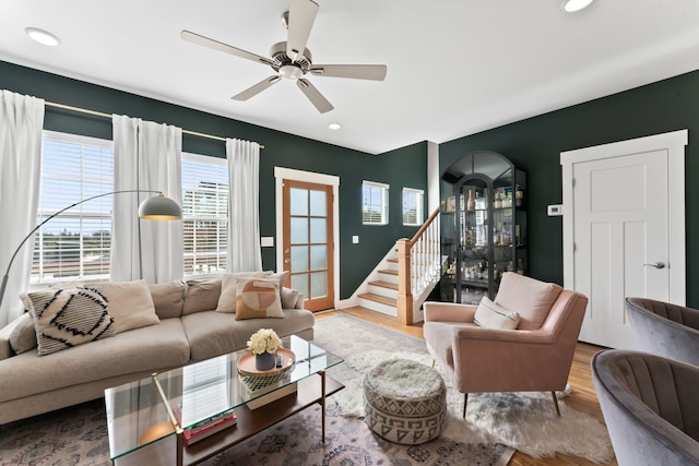 living room with ceiling fan and wood-type flooring