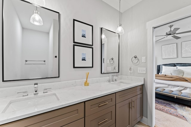 bathroom with ceiling fan and vanity