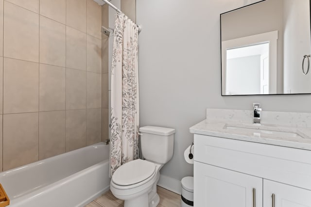 full bathroom with vanity, wood-type flooring, shower / bath combo, and toilet