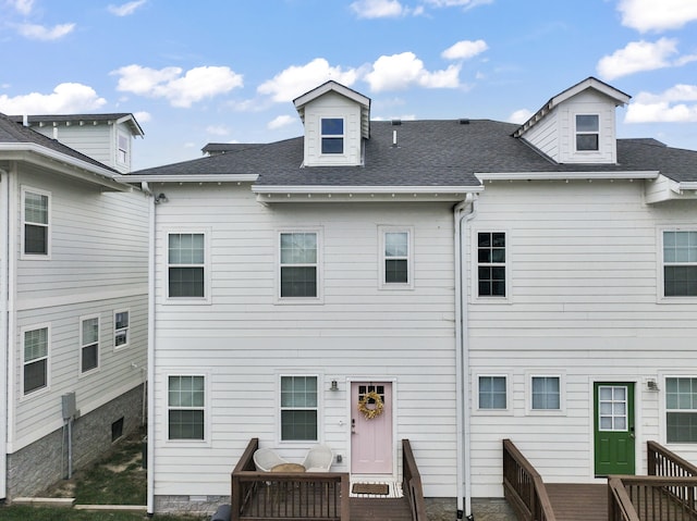 rear view of house featuring a deck