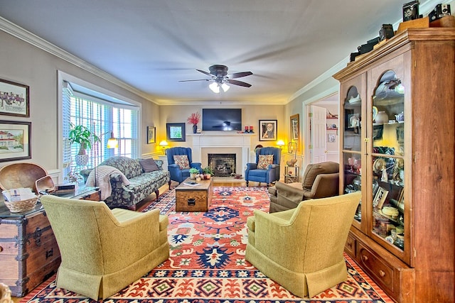 living room with crown molding and ceiling fan