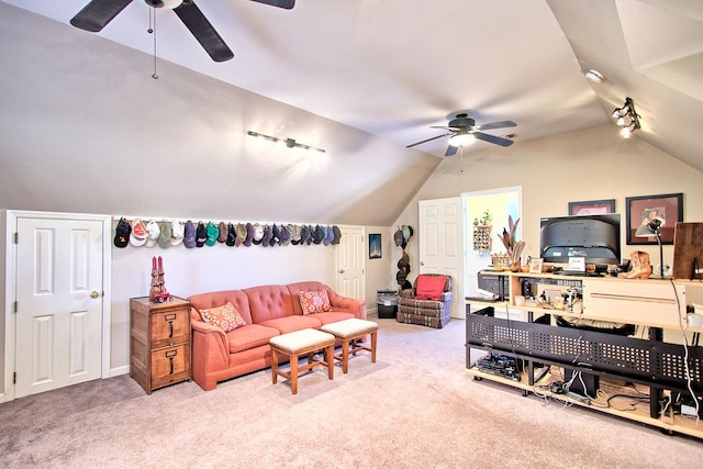 living room with track lighting, vaulted ceiling, carpet floors, and ceiling fan