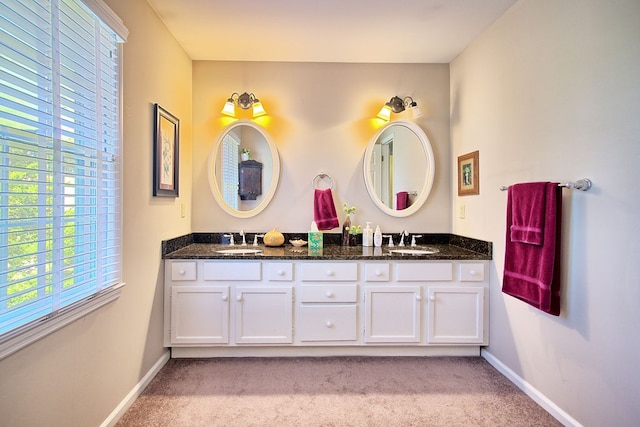 bathroom featuring vanity and plenty of natural light