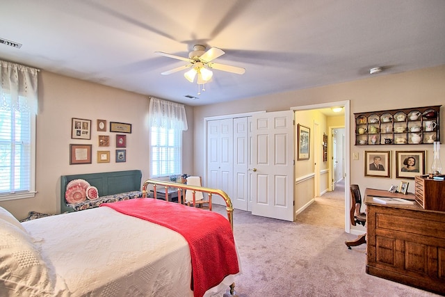 carpeted bedroom with ceiling fan