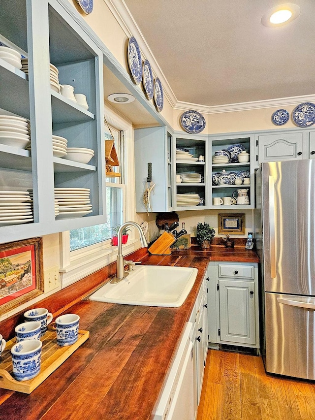 602 Edenburg Dr, Columbia, TN 38401 - kitchen with wood counters, freestanding refrigerator, white dishwasher, open shelves, and crown molding