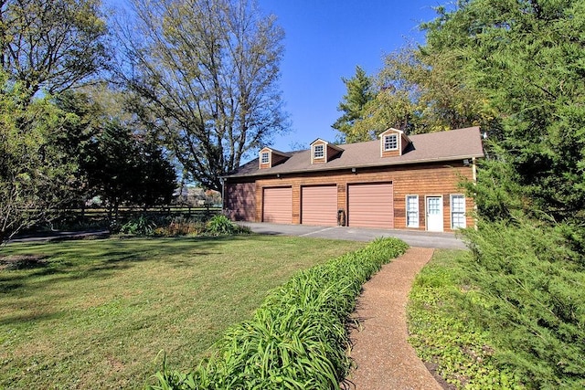 602 Edenburg Dr, Columbia, TN 38401 - view of yard with a garage and asphalt driveway