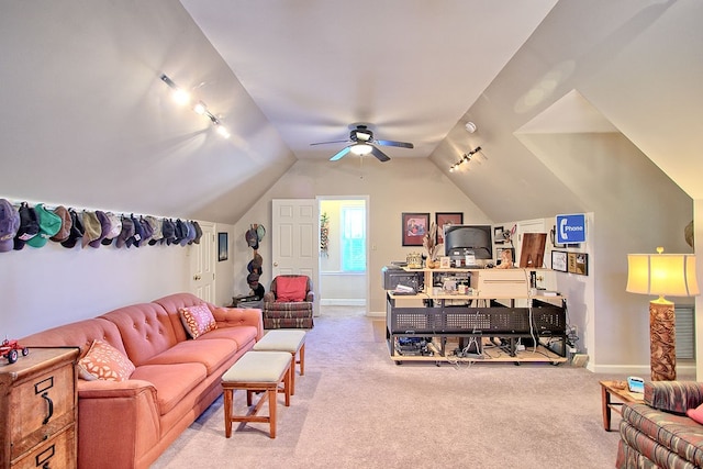 carpeted living room featuring ceiling fan, track lighting, and lofted ceiling