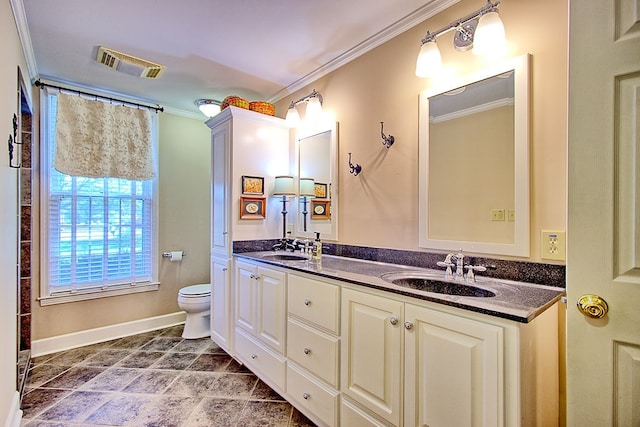 bathroom with vanity, toilet, and crown molding