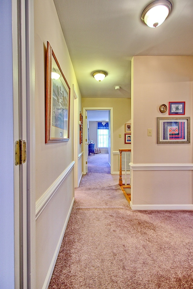 corridor featuring light carpet