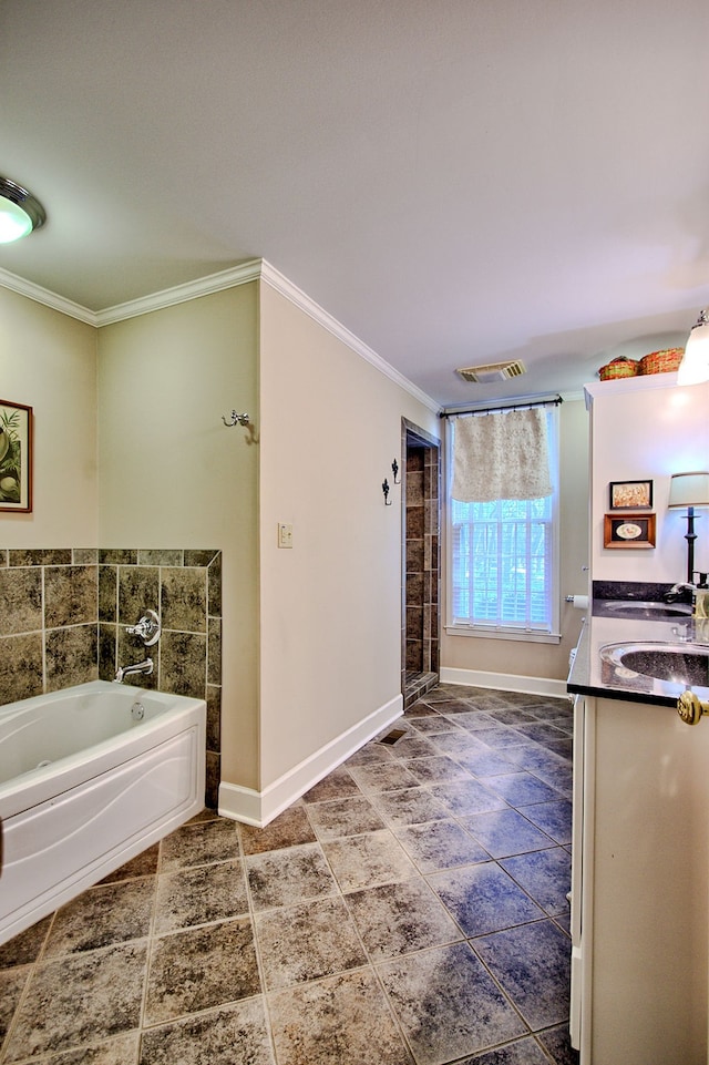 bathroom with vanity, a tub to relax in, and ornamental molding