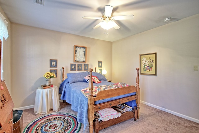 bedroom featuring light colored carpet and ceiling fan